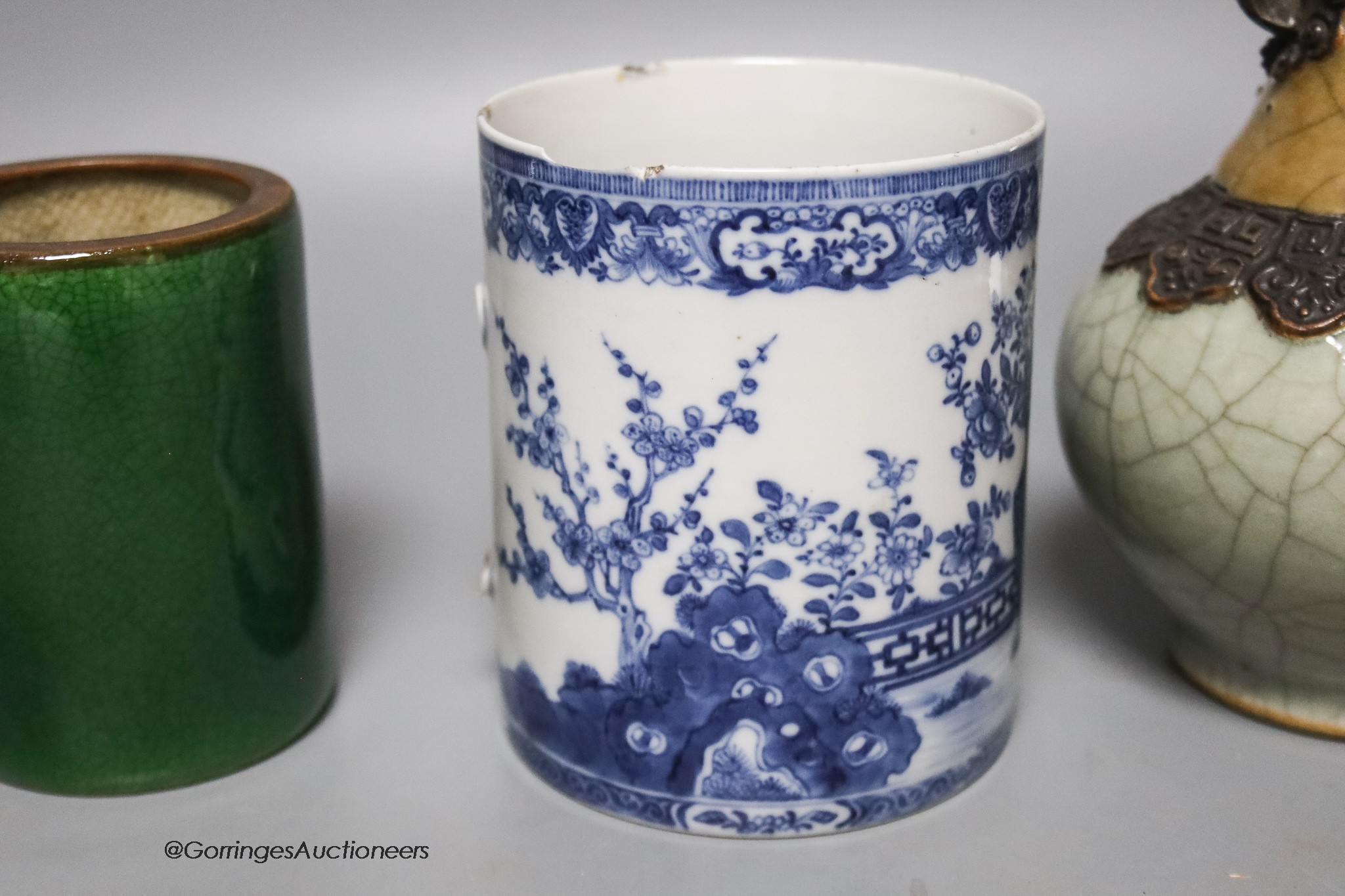 A Chinese crackleglaze vase, a blue and white brush pot and a green glazed brush pot, tallest 22cm